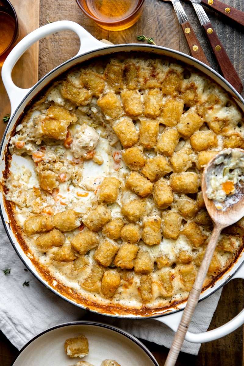 Chicken Tater Tot Casserole that has been dug into with a serving spoon.