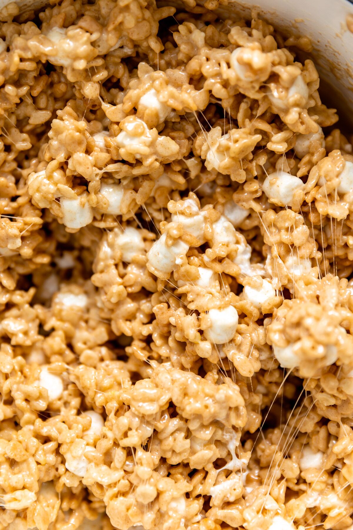 A close-up photo of brown butter rice krispies just stirred together. 