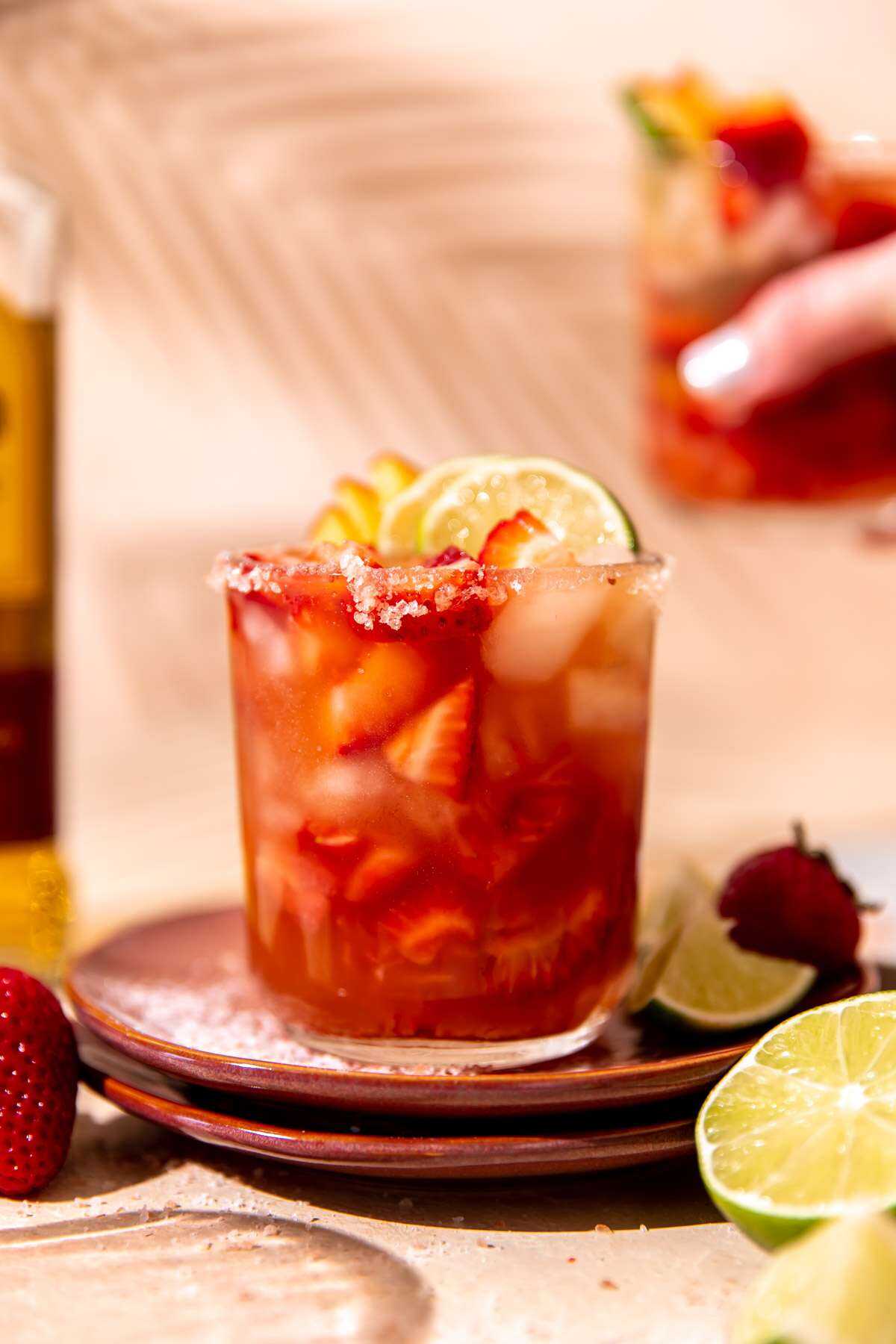 Two Strawberry Smash Peach Margaritas ready to be sipped on and enjoyed!
