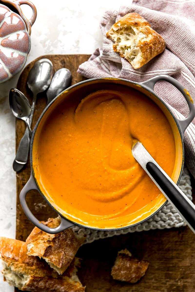 An overhead photo of smooth butternut squash soup in a saucepan.