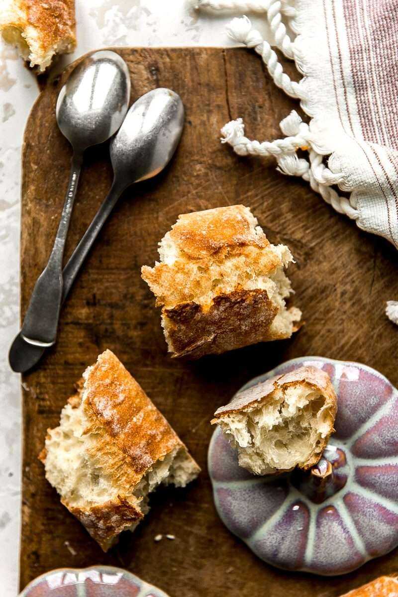 Leftover pieces of baguette and spoons.