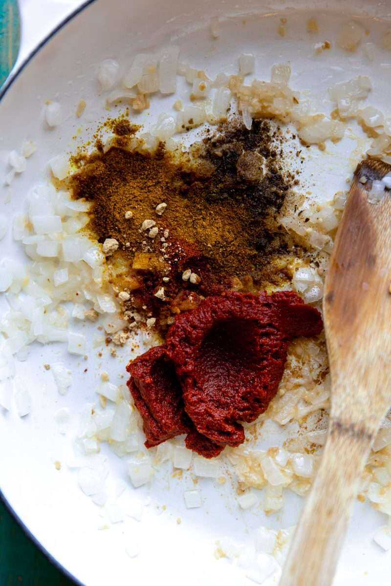 All the seasonings for the Easy Coconut Chicken Curry in a skillet. 