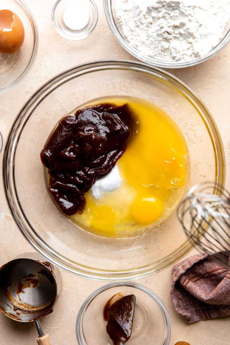 Melted butter, eggs and apple butter ready to be mixed together in a mixing bowl. 