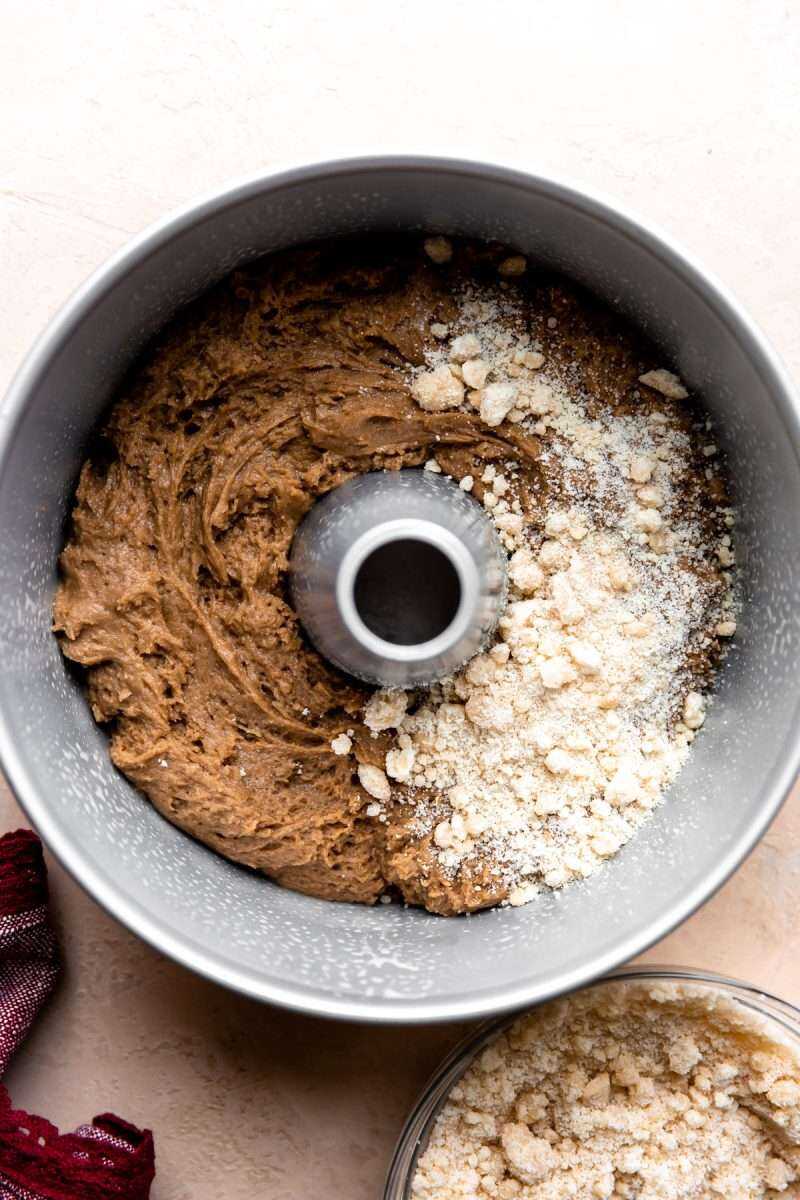 Apple Butter Coffee Cake batter in a pan with streusel topping before baking.