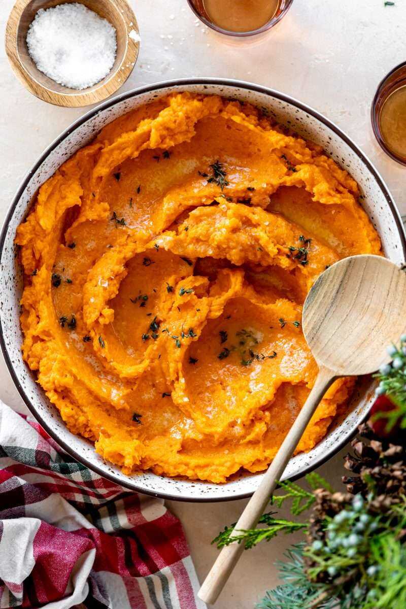 Mashed Sweet Potatoes in a serving platter on the holiday table. 