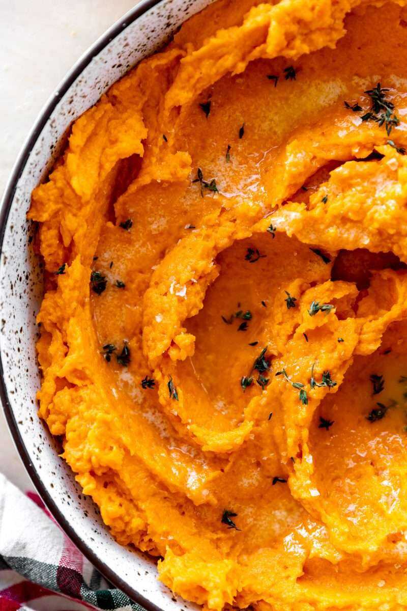 Mashed sweet potatoes in a serving dish.