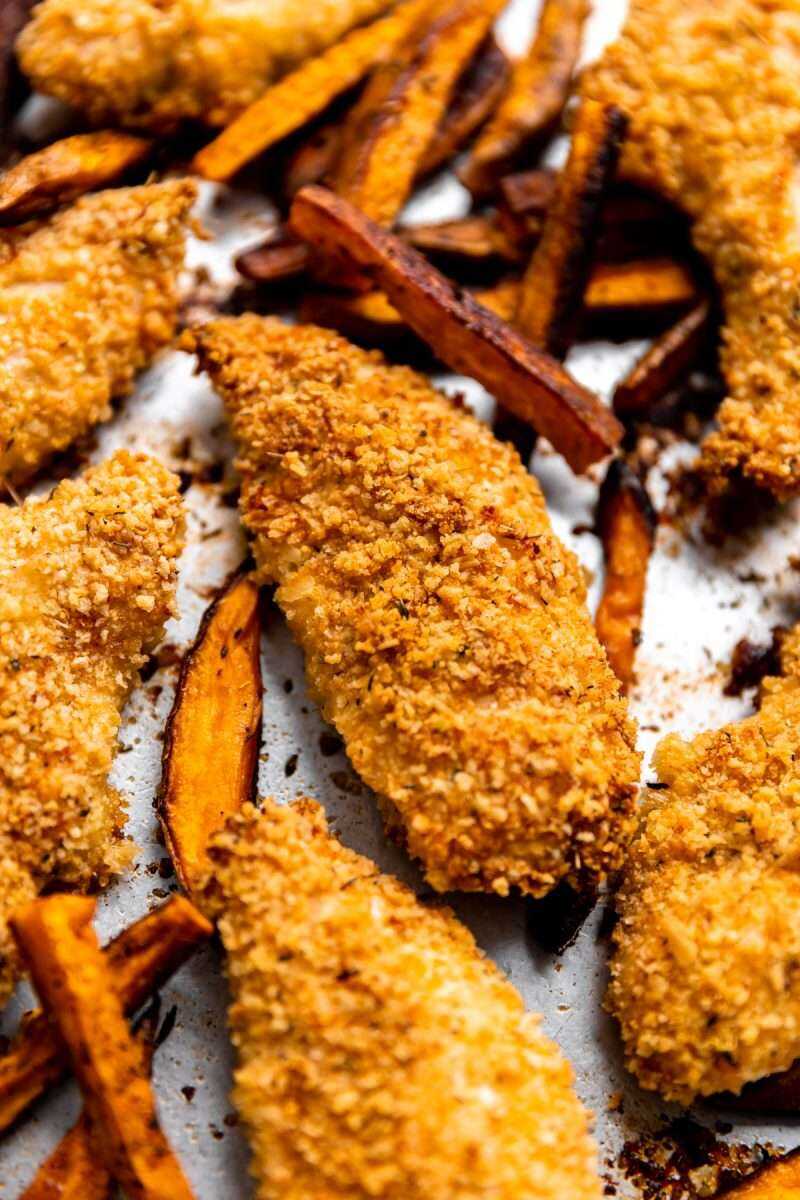 Sheet pan parmesan chicken fingers & sweet potato fries. 