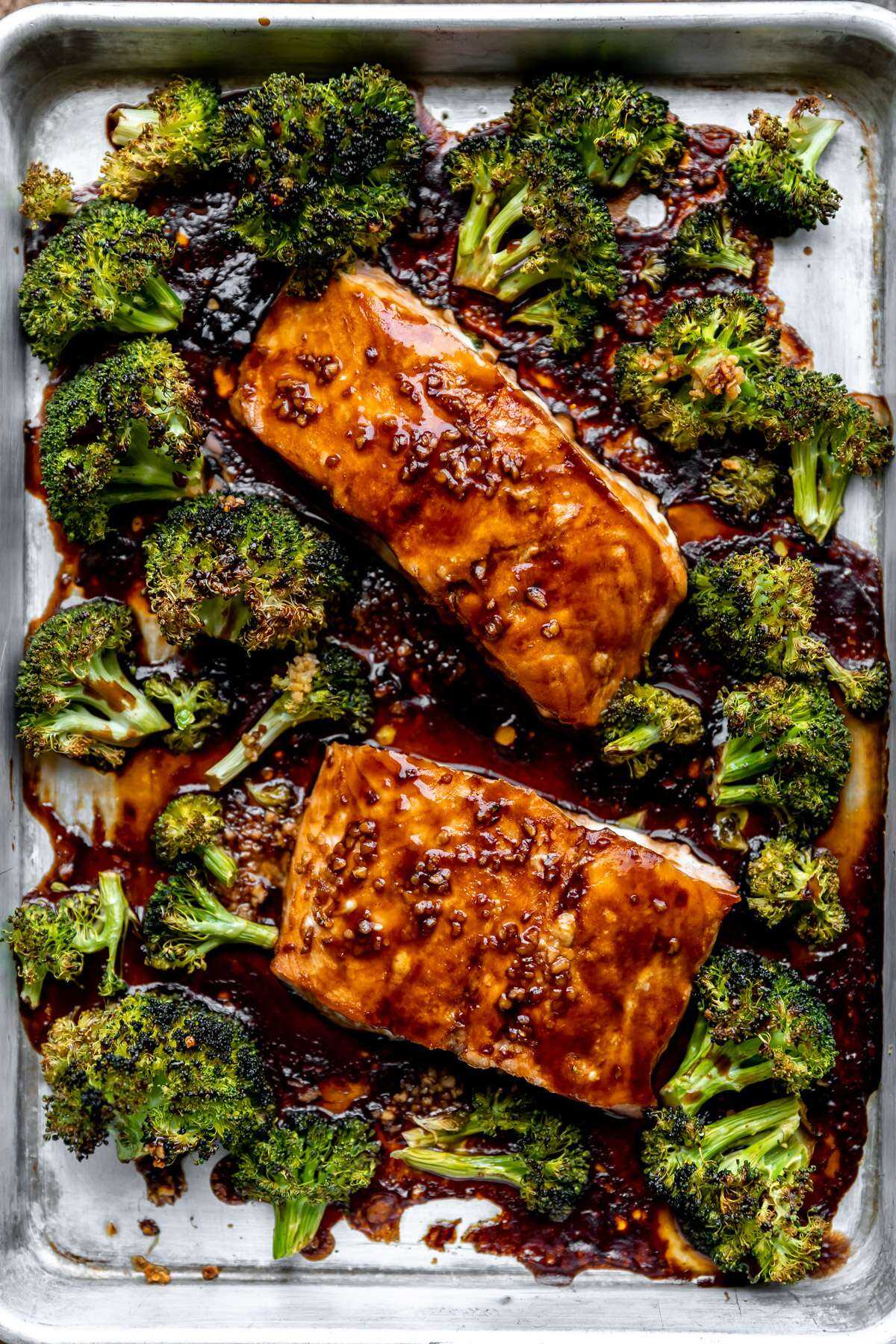 Roasted teriyaki salmon and broccoli on a sheet pan.