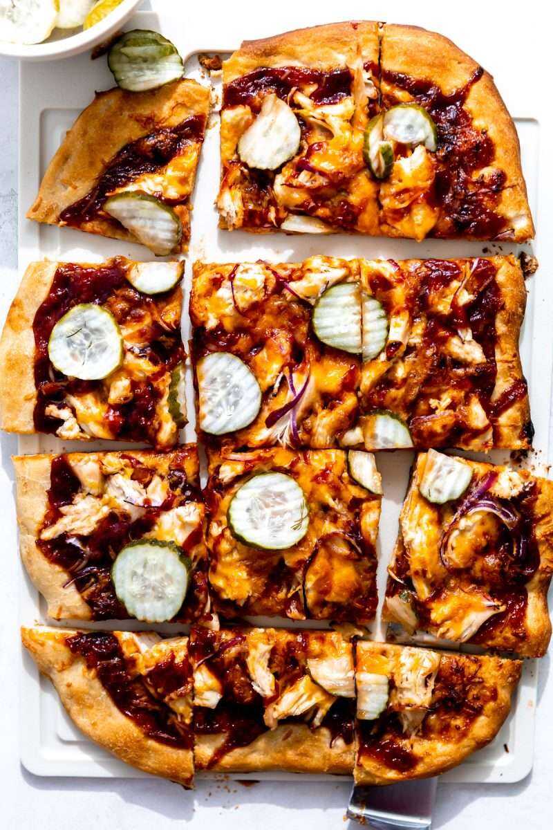 A sliced bbq chicken pizza ready for serving. 