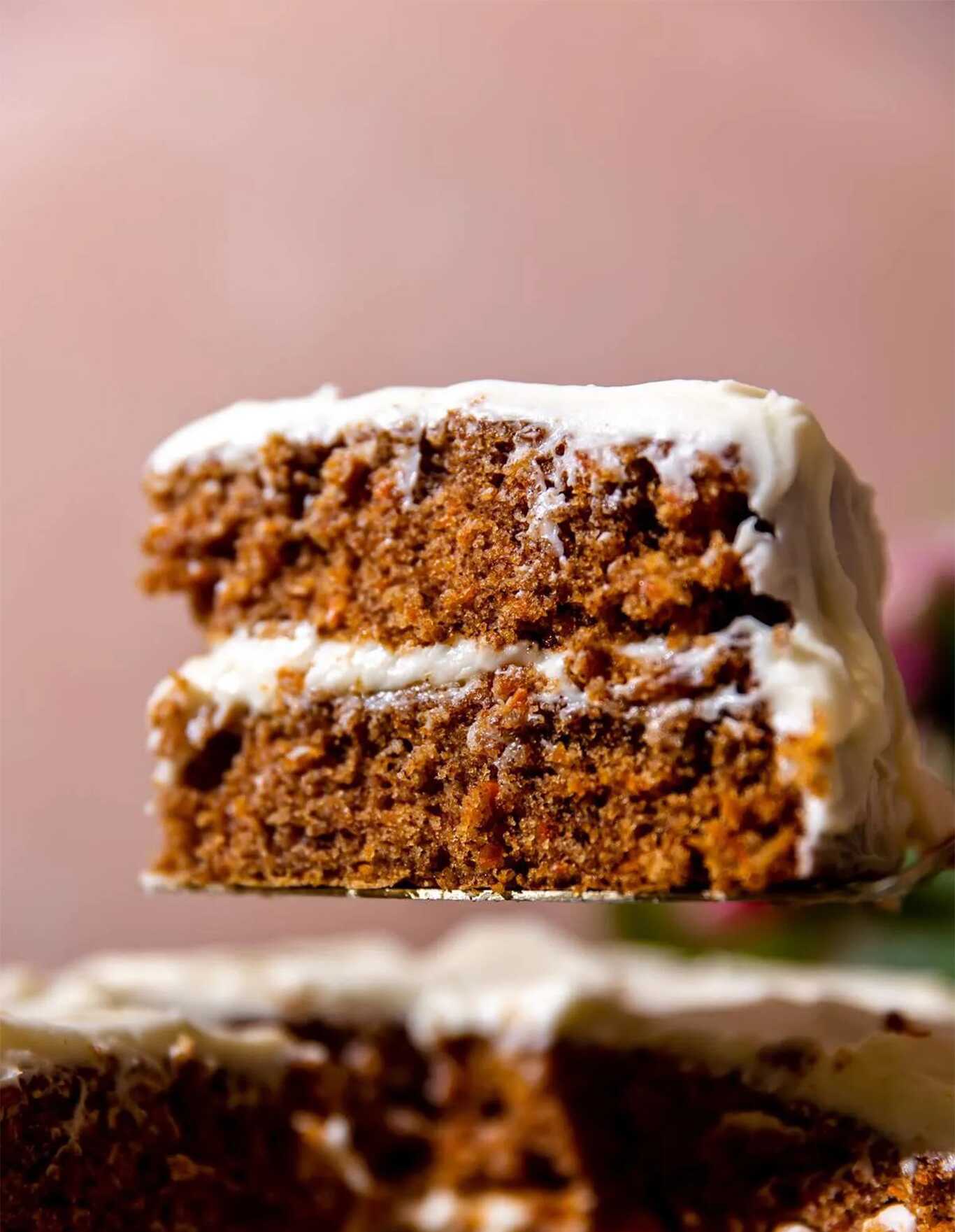 A hand reaching in and grabbing a slice of banana bread.