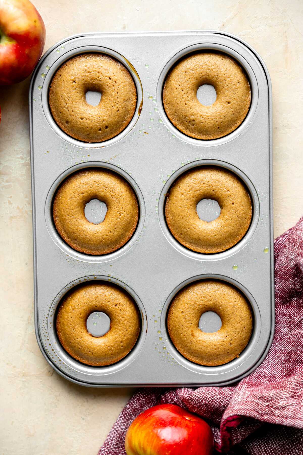 Baked apple cider donuts in the donut pan.
