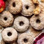 Baked apple cider donuts coated in cinnamon sugar.