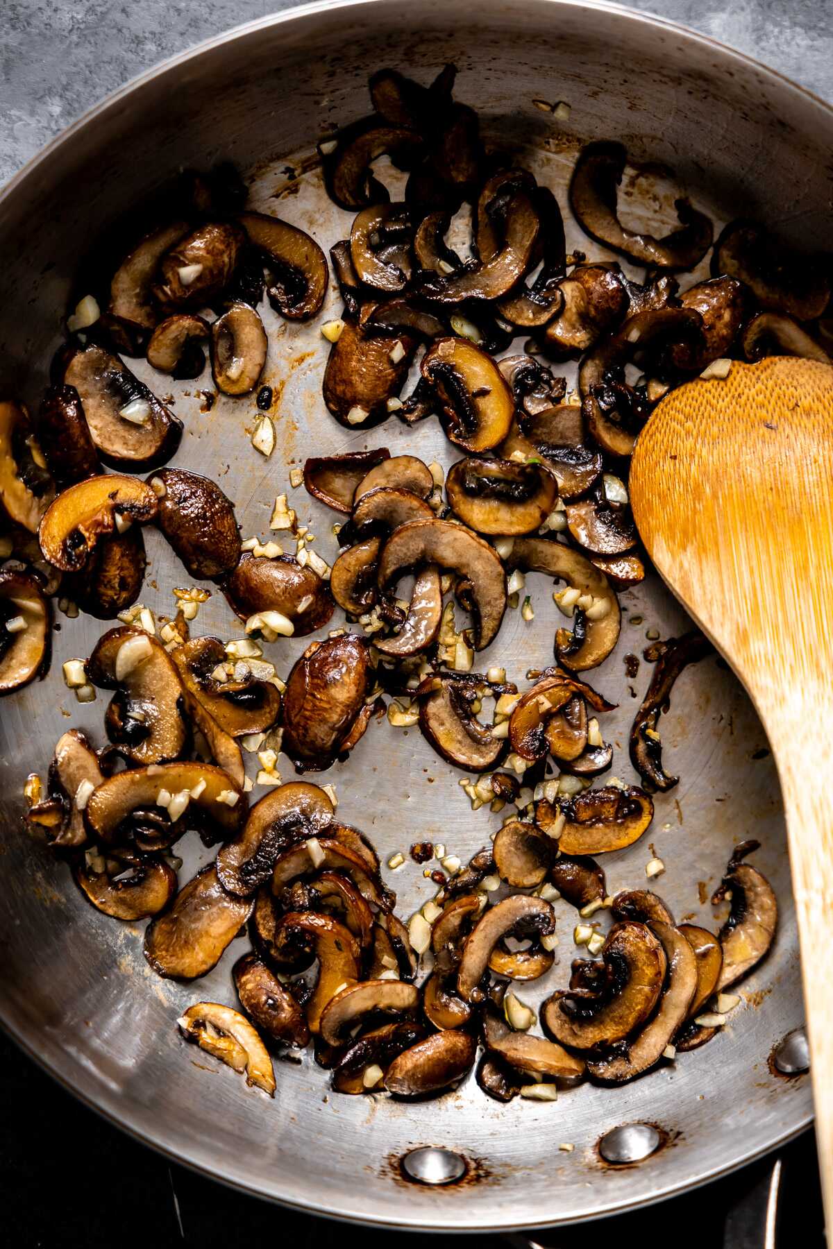 Sautéd mushrooms and garlic in a skillet. 