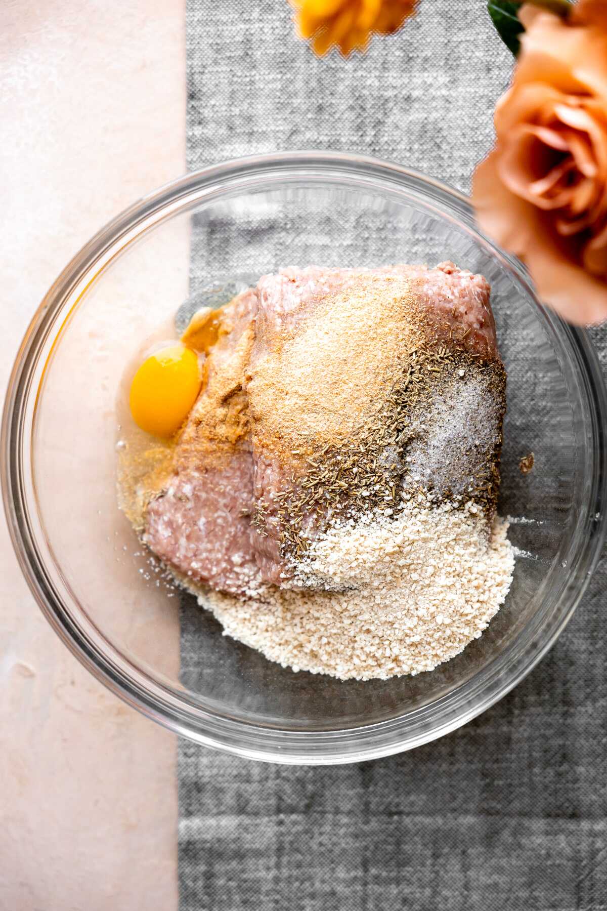 All of the meatball ingredients in a mixing bowl. 