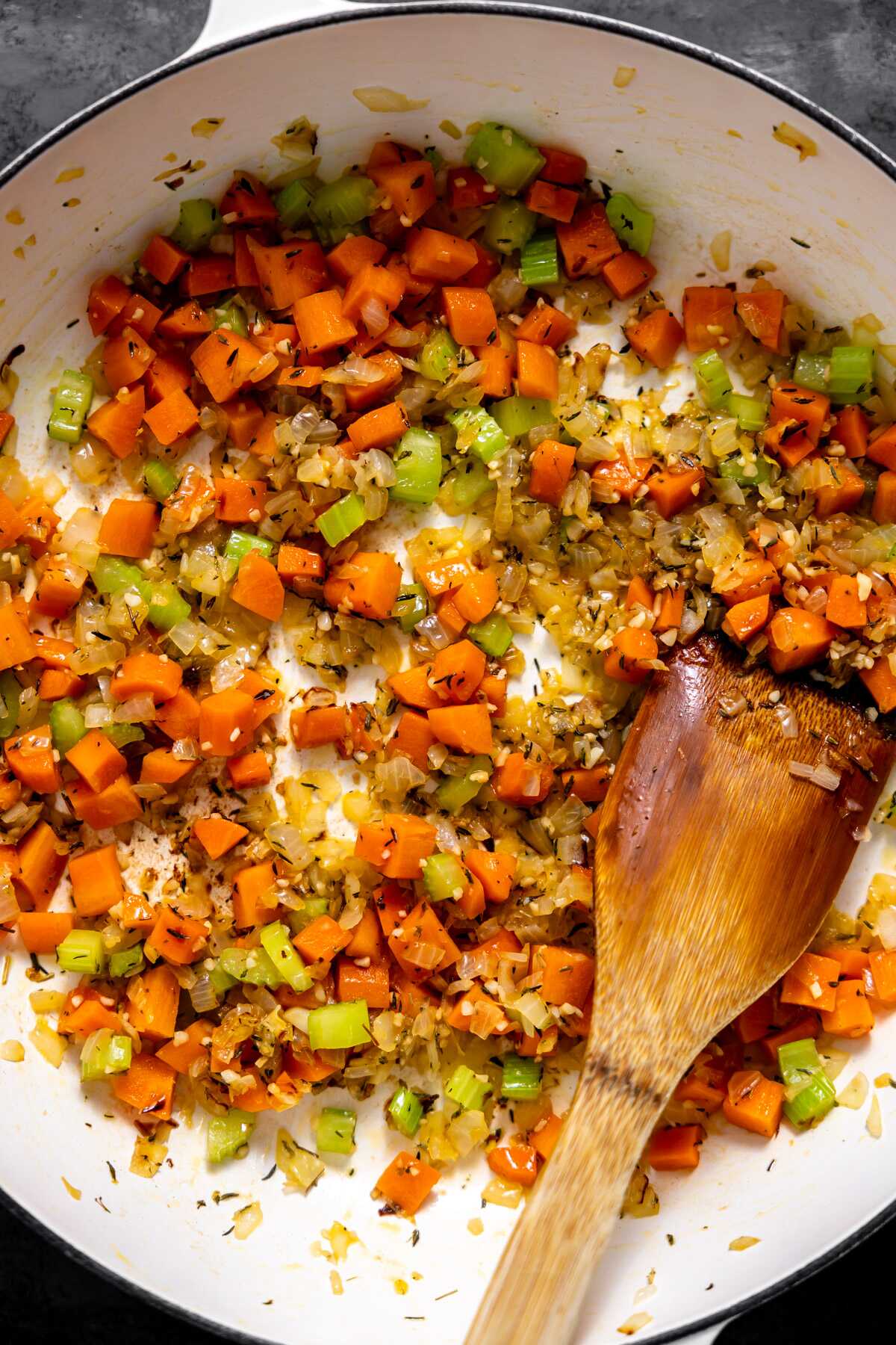 Sautéd carrots, onion and celery in a skillet. 