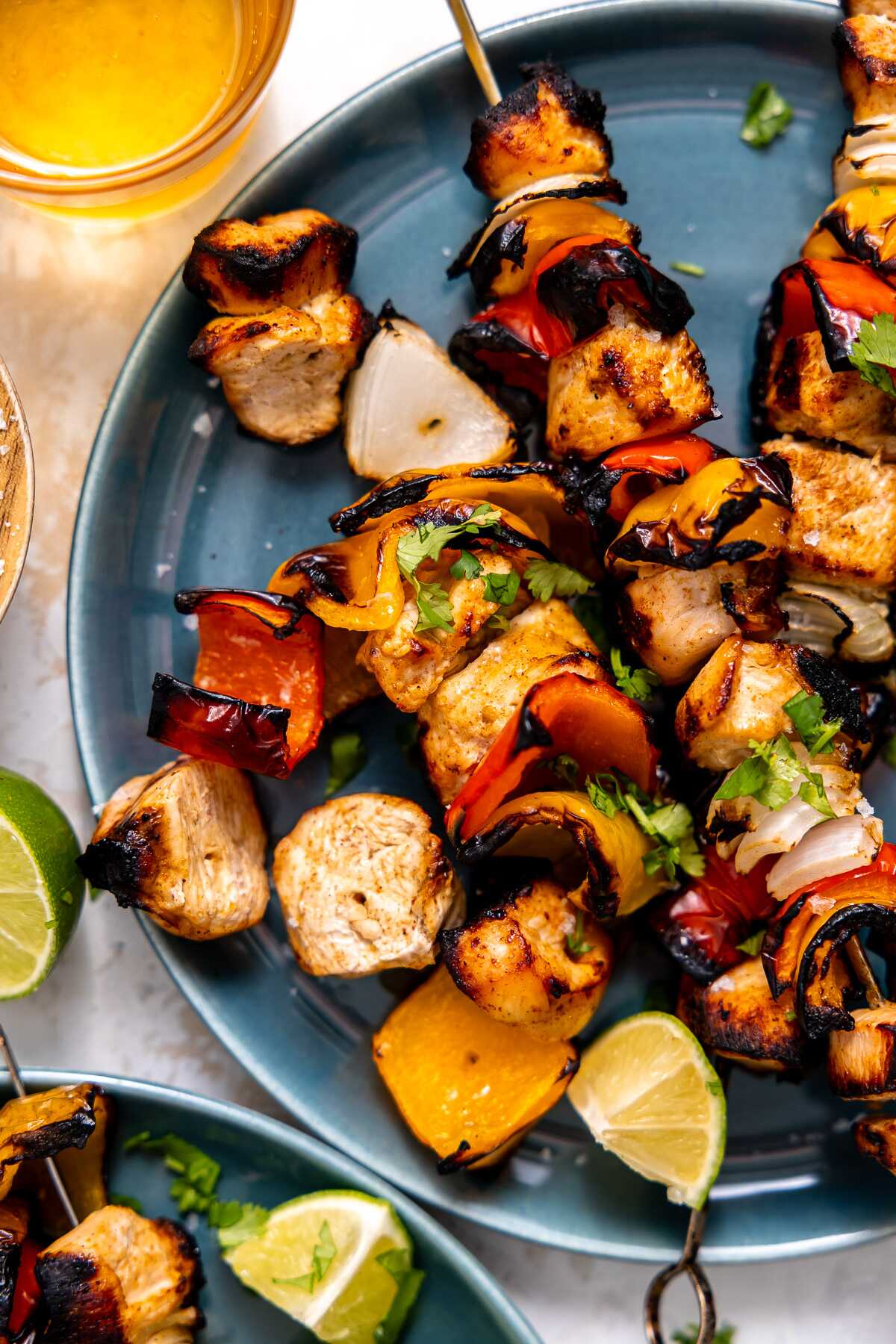 A close-up photo of grilled chicken fajita kabobs.