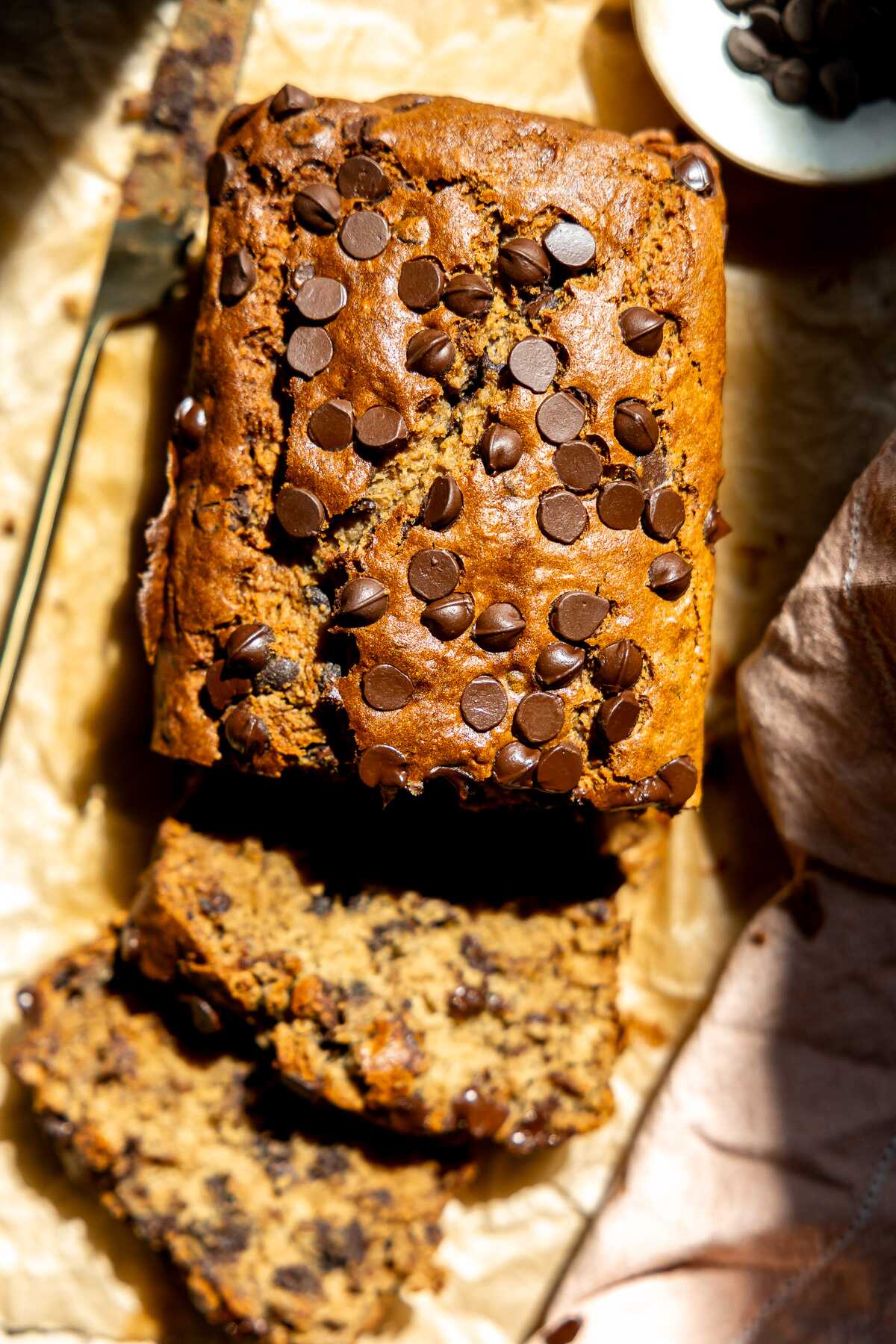 A sliced loaf of gluten free chocolate chip banana bread. 