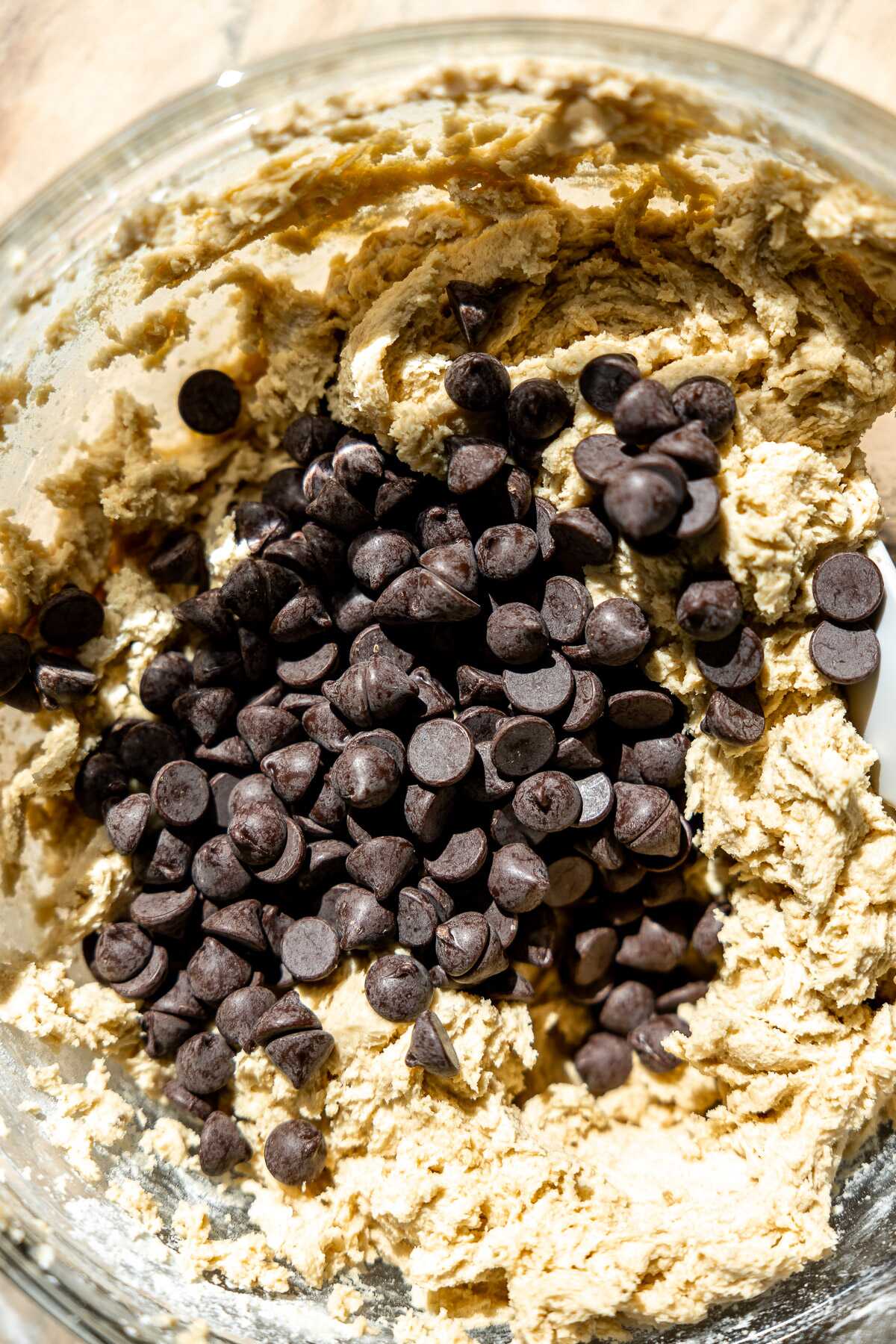 chocolate chip cookie pie dough mixed with chocolate chips dumped on top 