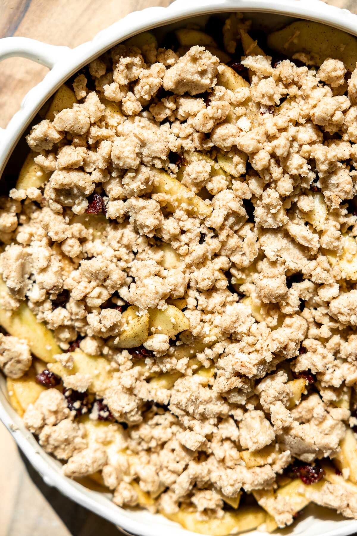 close up photo of cranberry apple topped with crumble