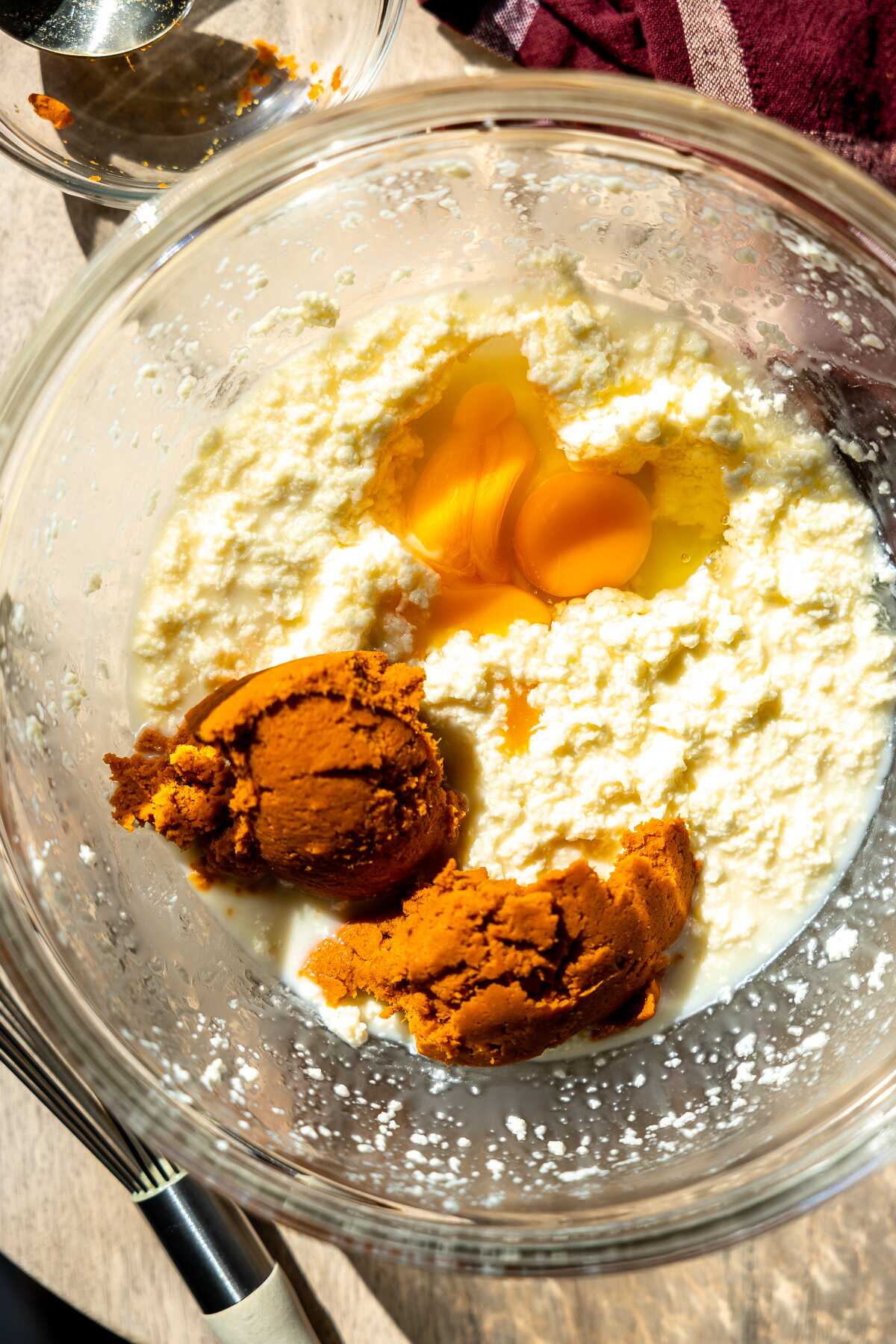 eggs,pumpkin puree and flour in a bowl