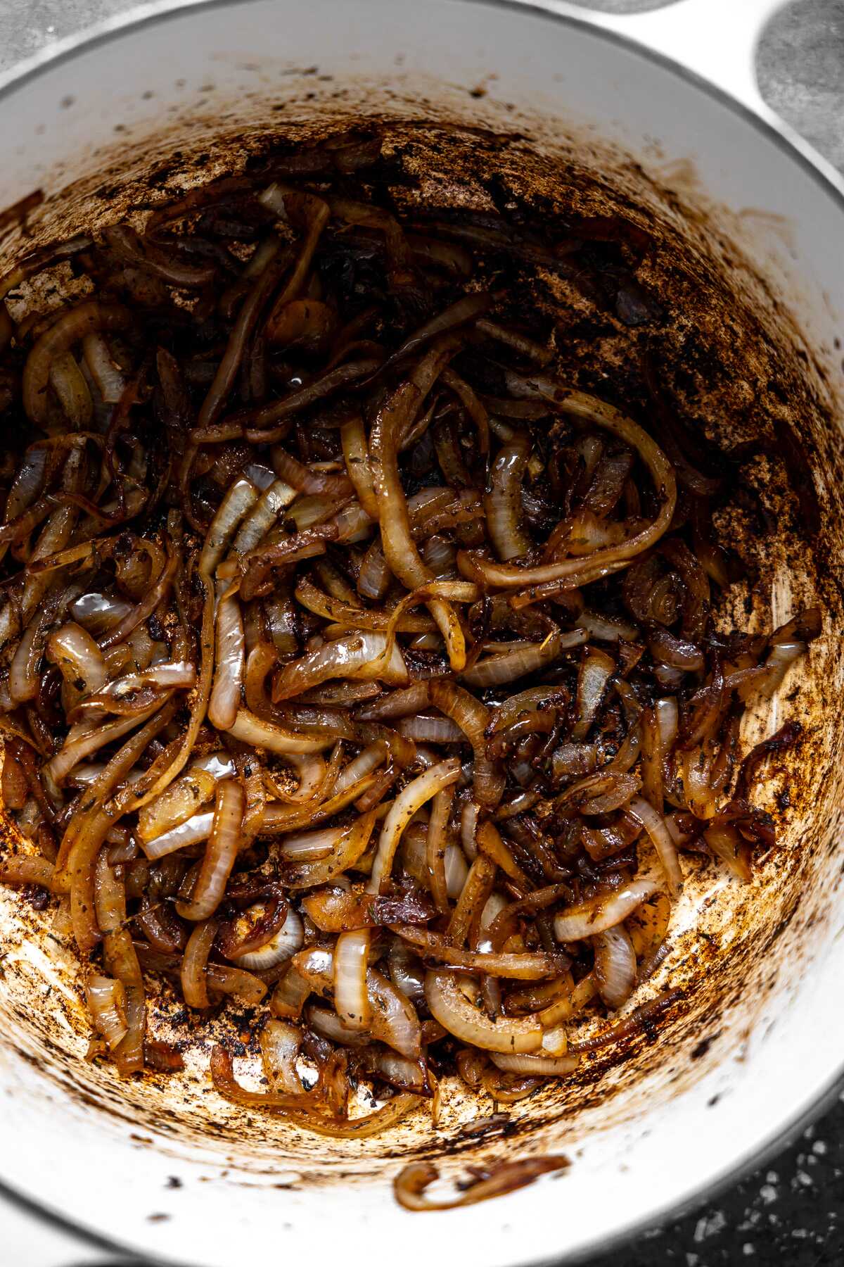 sliced onion being caramelized in a dutch oven. 