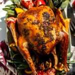 A citrus herb roasted turkey on a serving platter.
