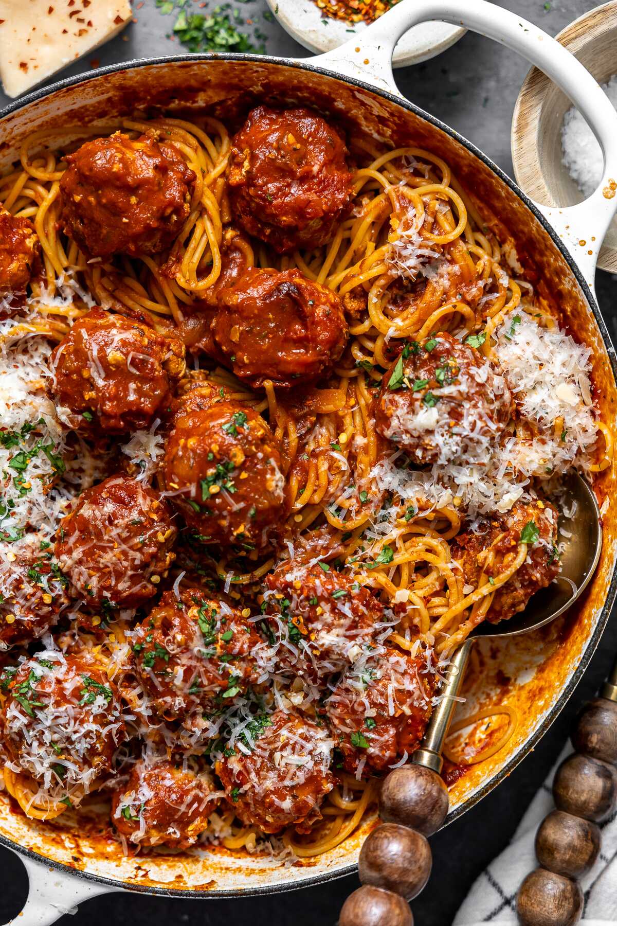 A close-up photo of the spicy turkey meatballs served over spaghetti.