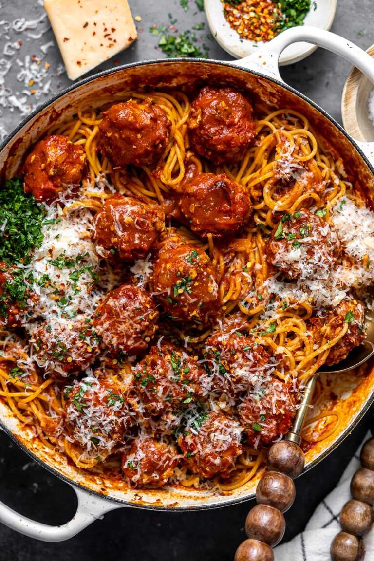 Spicy turkey meatballs served on top of spaghetti topped with parmesan cheese, chopped parsley and red pepper flakes.