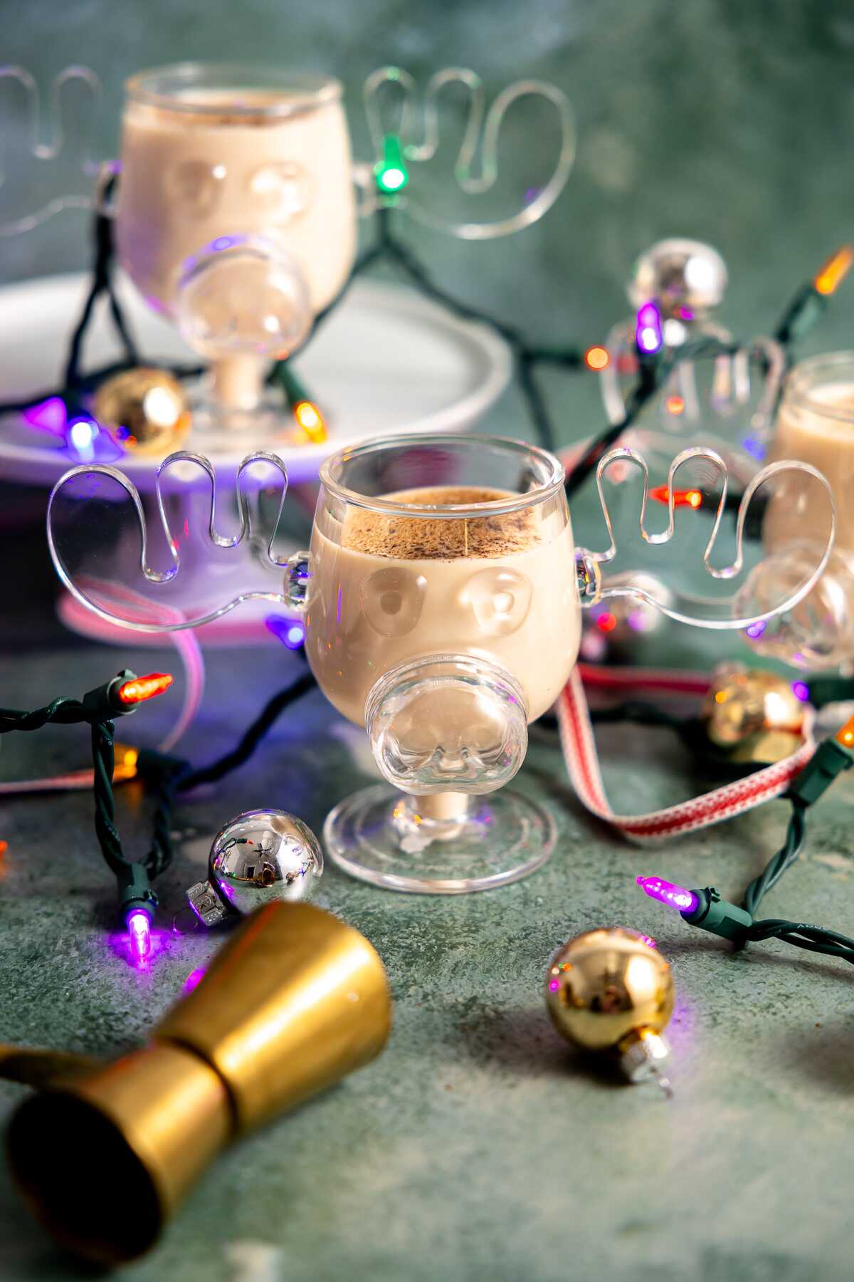 The Clark Griswold Cocktail in a moose mug with Christmas lights around.