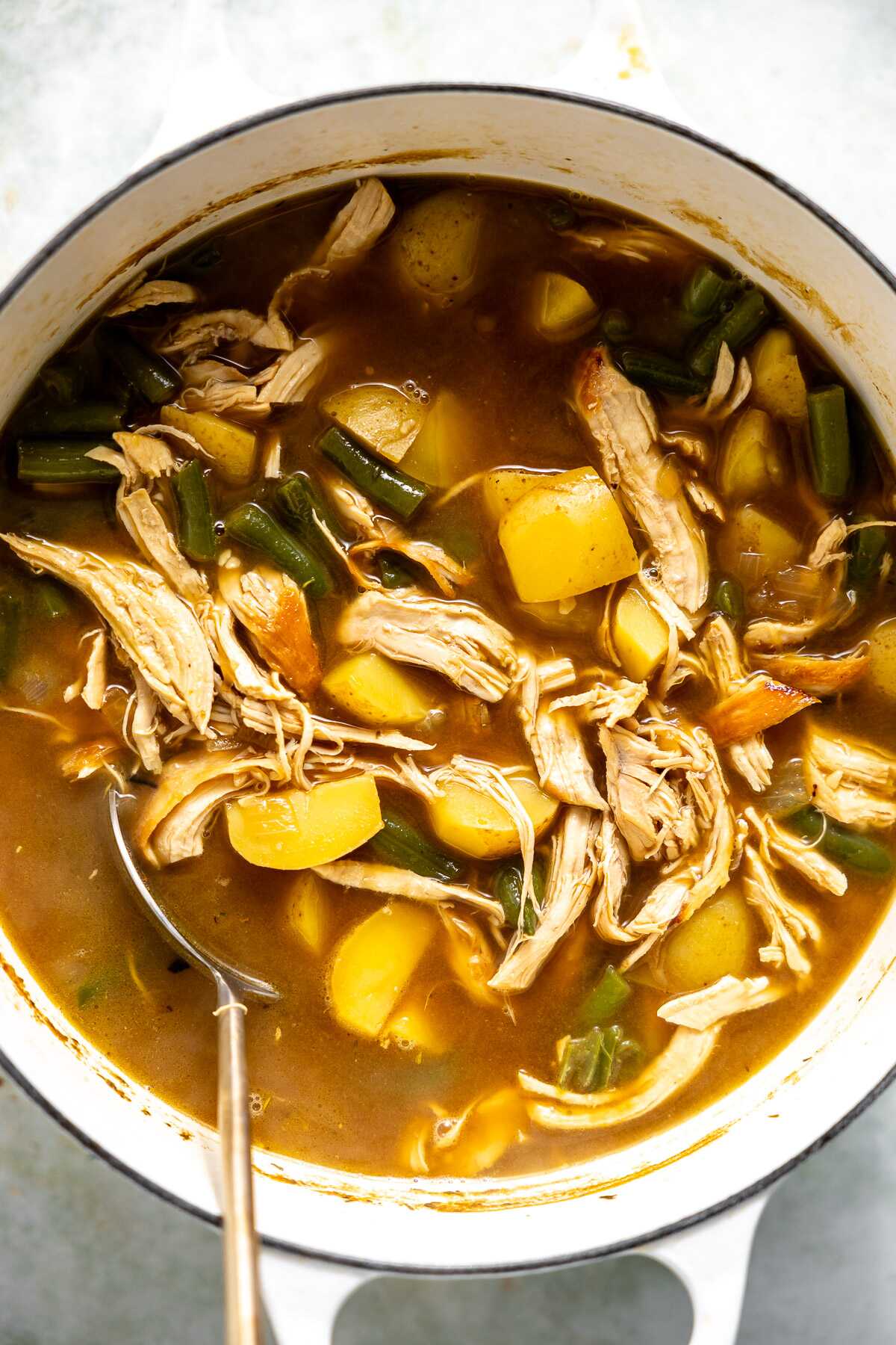 Chicken dinner soup in a stock pot.