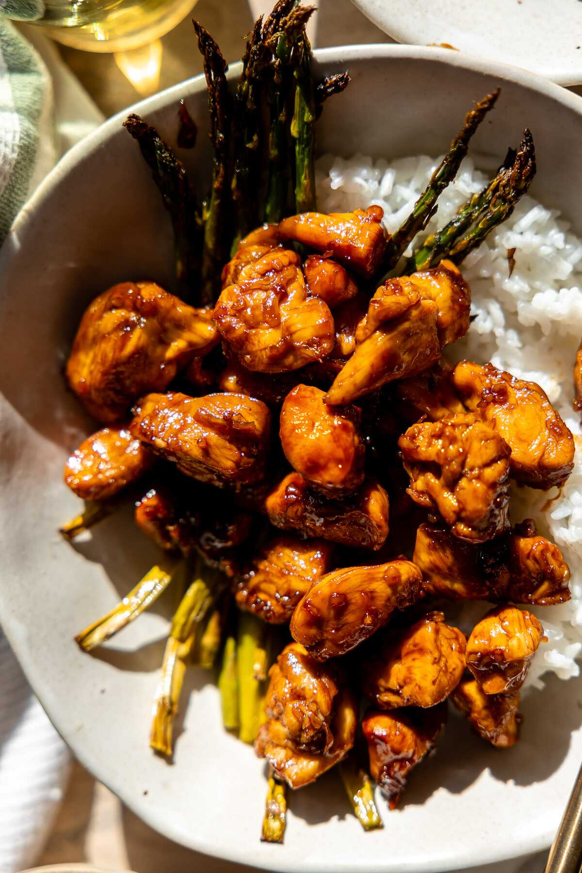 Honey Balsamic Chicken Bowls on a sunlit table.